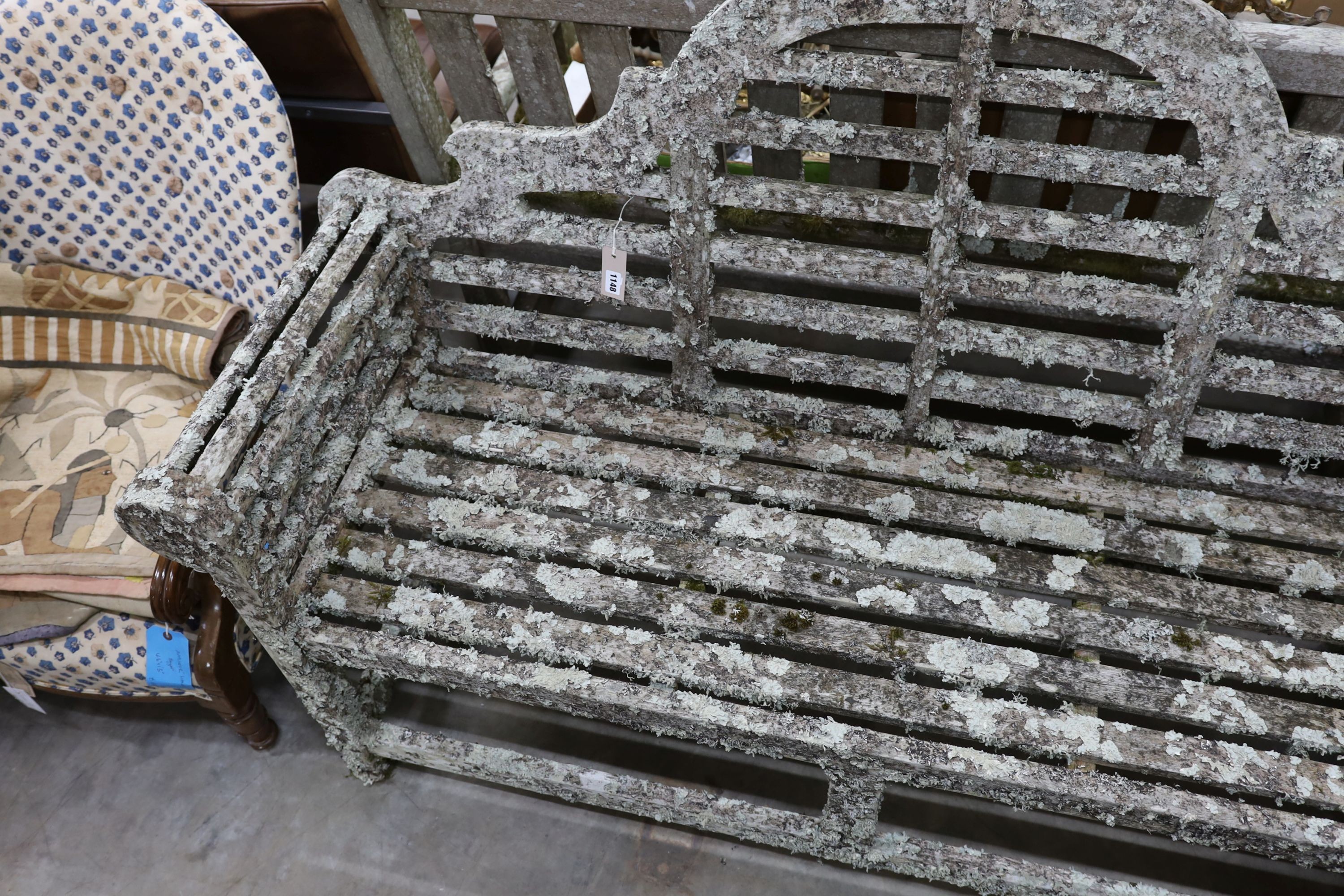 A Lutyens style lichen covered teak garden bench, length 160cm, depth 52cm, height 102cm